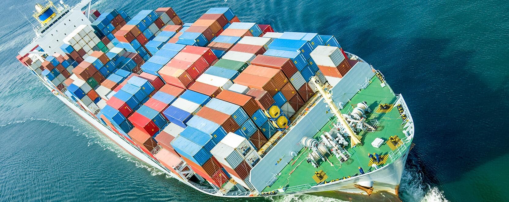 Aerial view of cargo ship carrying colorful containers